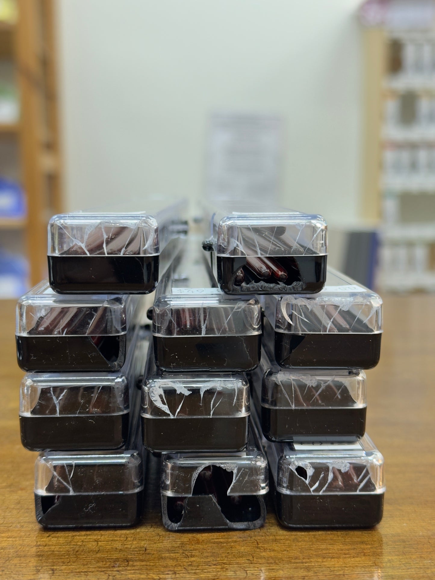 a stack of packaged brushes with cracked cases